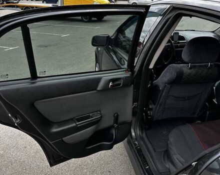 Черный Опель Астра, объемом двигателя 1.4 л и пробегом 277 тыс. км за 3300 $, фото 12 на Automoto.ua