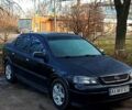 Черный Опель Астра, объемом двигателя 1.6 л и пробегом 210 тыс. км за 3100 $, фото 1 на Automoto.ua