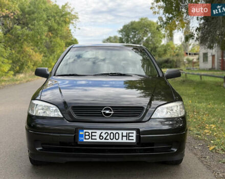 Черный Опель Астра, объемом двигателя 1.4 л и пробегом 250 тыс. км за 3650 $, фото 1 на Automoto.ua