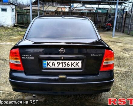Черный Опель Астра, объемом двигателя 1.4 л и пробегом 250 тыс. км за 3999 $, фото 4 на Automoto.ua