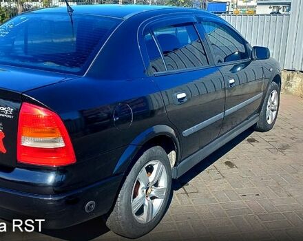 Черный Опель Астра, объемом двигателя 1.4 л и пробегом 290 тыс. км за 4300 $, фото 2 на Automoto.ua