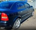 Черный Опель Астра, объемом двигателя 1.4 л и пробегом 290 тыс. км за 4300 $, фото 2 на Automoto.ua
