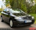 Черный Опель Астра, объемом двигателя 1.4 л и пробегом 250 тыс. км за 4000 $, фото 1 на Automoto.ua