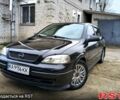 Черный Опель Астра, объемом двигателя 1.4 л и пробегом 250 тыс. км за 3999 $, фото 1 на Automoto.ua