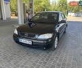 Черный Опель Астра, объемом двигателя 1.4 л и пробегом 107 тыс. км за 4800 $, фото 1 на Automoto.ua