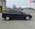 Черный Опель Астра, объемом двигателя 1.4 л и пробегом 229 тыс. км за 3200 $, фото 3 на Automoto.ua