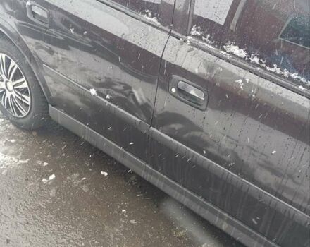 Черный Опель Астра, объемом двигателя 1.4 л и пробегом 150 тыс. км за 2300 $, фото 7 на Automoto.ua