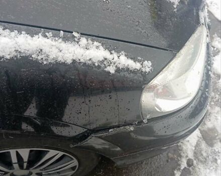 Черный Опель Астра, объемом двигателя 1.4 л и пробегом 150 тыс. км за 2300 $, фото 8 на Automoto.ua