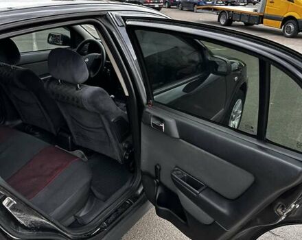 Черный Опель Астра, объемом двигателя 1.4 л и пробегом 277 тыс. км за 3300 $, фото 13 на Automoto.ua