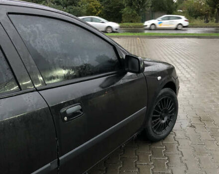 Черный Опель Астра, объемом двигателя 1.36 л и пробегом 292 тыс. км за 2700 $, фото 7 на Automoto.ua