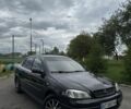 Черный Опель Астра, объемом двигателя 1.6 л и пробегом 315 тыс. км за 2400 $, фото 1 на Automoto.ua
