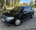 Черный Опель Астра, объемом двигателя 1.4 л и пробегом 250 тыс. км за 3700 $, фото 1 на Automoto.ua