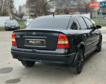 Черный Опель Астра, объемом двигателя 1.4 л и пробегом 102 тыс. км за 3600 $, фото 12 на Automoto.ua