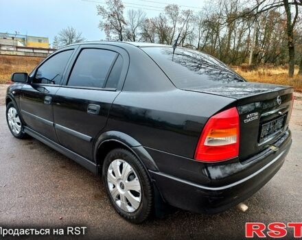 Черный Опель Астра, объемом двигателя 1.4 л и пробегом 230 тыс. км за 4200 $, фото 5 на Automoto.ua