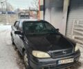 Черный Опель Астра, объемом двигателя 1.6 л и пробегом 254 тыс. км за 2400 $, фото 1 на Automoto.ua