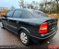 Черный Опель Астра, объемом двигателя 1.4 л и пробегом 230 тыс. км за 4200 $, фото 2 на Automoto.ua