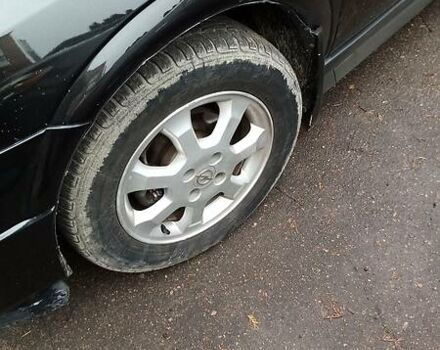 Черный Опель Астра, объемом двигателя 1.4 л и пробегом 155 тыс. км за 3700 $, фото 7 на Automoto.ua