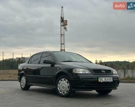 Черный Опель Астра, объемом двигателя 1.4 л и пробегом 216 тыс. км за 3999 $, фото 4 на Automoto.ua