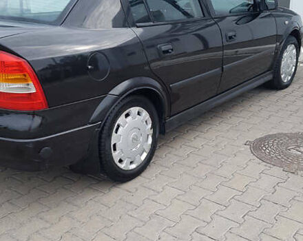 Черный Опель Астра, объемом двигателя 1.4 л и пробегом 230 тыс. км за 3800 $, фото 1 на Automoto.ua