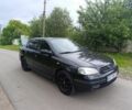 Черный Опель Астра, объемом двигателя 4 л и пробегом 162 тыс. км за 3600 $, фото 1 на Automoto.ua