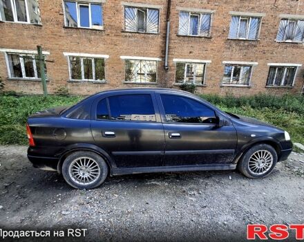 Черный Опель Астра, объемом двигателя 1.4 л и пробегом 300 тыс. км за 1300 $, фото 4 на Automoto.ua
