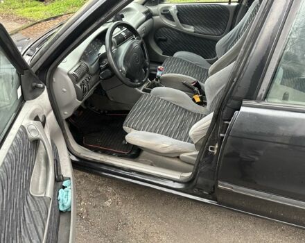 Черный Опель Астра, объемом двигателя 1.8 л и пробегом 100 тыс. км за 1250 $, фото 7 на Automoto.ua