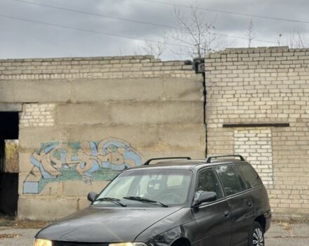 Черный Опель Астра, объемом двигателя 1.6 л и пробегом 341 тыс. км за 1000 $, фото 2 на Automoto.ua