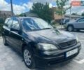 Черный Опель Астра, объемом двигателя 1.6 л и пробегом 385 тыс. км за 2550 $, фото 1 на Automoto.ua