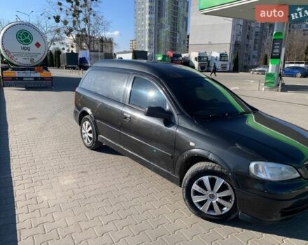 Черный Опель Астра, объемом двигателя 1.7 л и пробегом 176 тыс. км за 1750 $, фото 1 на Automoto.ua
