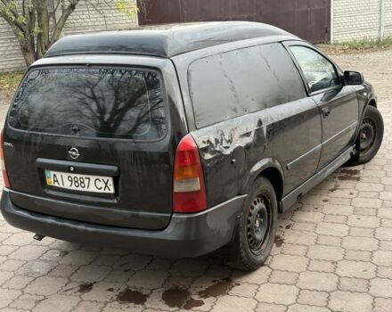 Черный Опель Астра, объемом двигателя 1.7 л и пробегом 666 тыс. км за 1375 $, фото 4 на Automoto.ua