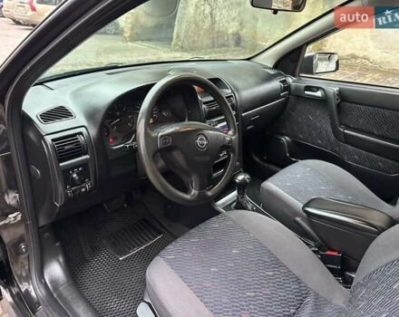 Черный Опель Астра, объемом двигателя 2 л и пробегом 340 тыс. км за 3900 $, фото 79 на Automoto.ua