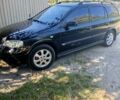 Черный Опель Астра, объемом двигателя 1.6 л и пробегом 280 тыс. км за 3900 $, фото 4 на Automoto.ua