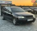 Черный Опель Астра, объемом двигателя 1.6 л и пробегом 290 тыс. км за 3300 $, фото 2 на Automoto.ua