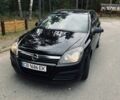 Черный Опель Астра, объемом двигателя 1.6 л и пробегом 234 тыс. км за 5000 $, фото 1 на Automoto.ua