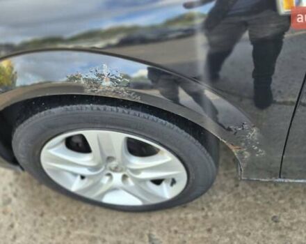 Черный Опель Астра, объемом двигателя 1.6 л и пробегом 264 тыс. км за 4700 $, фото 2 на Automoto.ua