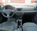 Черный Опель Астра, объемом двигателя 1.3 л и пробегом 322 тыс. км за 4700 $, фото 3 на Automoto.ua