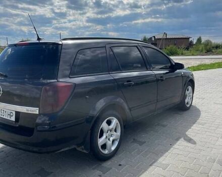 Черный Опель Астра, объемом двигателя 1.91 л и пробегом 242 тыс. км за 4500 $, фото 7 на Automoto.ua