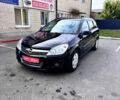 Черный Опель Астра, объемом двигателя 1.6 л и пробегом 234 тыс. км за 5600 $, фото 1 на Automoto.ua
