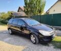 Черный Опель Астра, объемом двигателя 1.7 л и пробегом 240 тыс. км за 4999 $, фото 1 на Automoto.ua