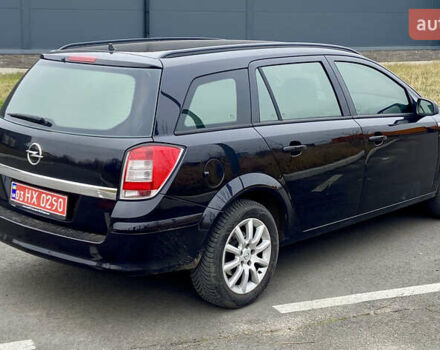 Черный Опель Астра, объемом двигателя 1.8 л и пробегом 200 тыс. км за 6999 $, фото 4 на Automoto.ua