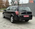 Черный Опель Астра, объемом двигателя 1.6 л и пробегом 240 тыс. км за 5550 $, фото 3 на Automoto.ua