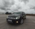 Черный Опель Астра, объемом двигателя 1.25 л и пробегом 325 тыс. км за 4699 $, фото 1 на Automoto.ua