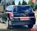 Черный Опель Астра, объемом двигателя 1.6 л и пробегом 195 тыс. км за 6700 $, фото 2 на Automoto.ua