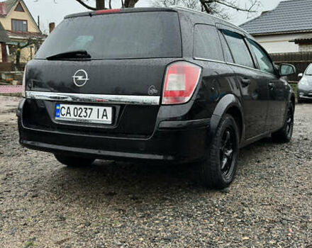 Черный Опель Астра, объемом двигателя 1.69 л и пробегом 242 тыс. км за 6200 $, фото 7 на Automoto.ua