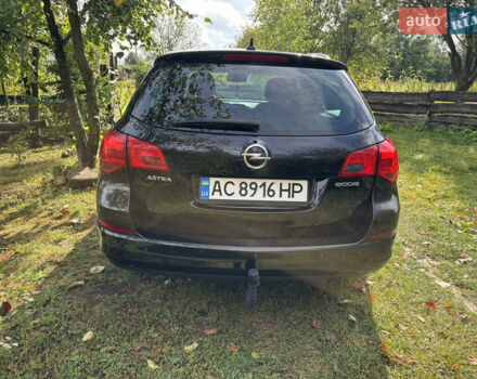 Черный Опель Астра, объемом двигателя 1.25 л и пробегом 243 тыс. км за 8150 $, фото 2 на Automoto.ua