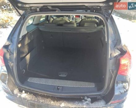 Черный Опель Астра, объемом двигателя 1.4 л и пробегом 229 тыс. км за 8760 $, фото 2 на Automoto.ua