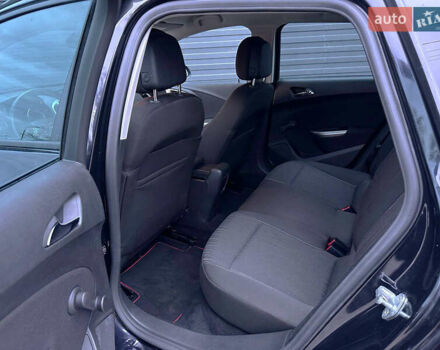 Черный Опель Астра, объемом двигателя 1.4 л и пробегом 180 тыс. км за 7500 $, фото 6 на Automoto.ua