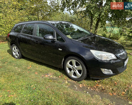 Черный Опель Астра, объемом двигателя 1.25 л и пробегом 243 тыс. км за 8150 $, фото 1 на Automoto.ua