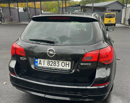 Черный Опель Астра, объемом двигателя 1.7 л и пробегом 275 тыс. км за 7400 $, фото 7 на Automoto.ua