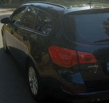 Черный Опель Астра, объемом двигателя 1.4 л и пробегом 274 тыс. км за 6899 $, фото 3 на Automoto.ua